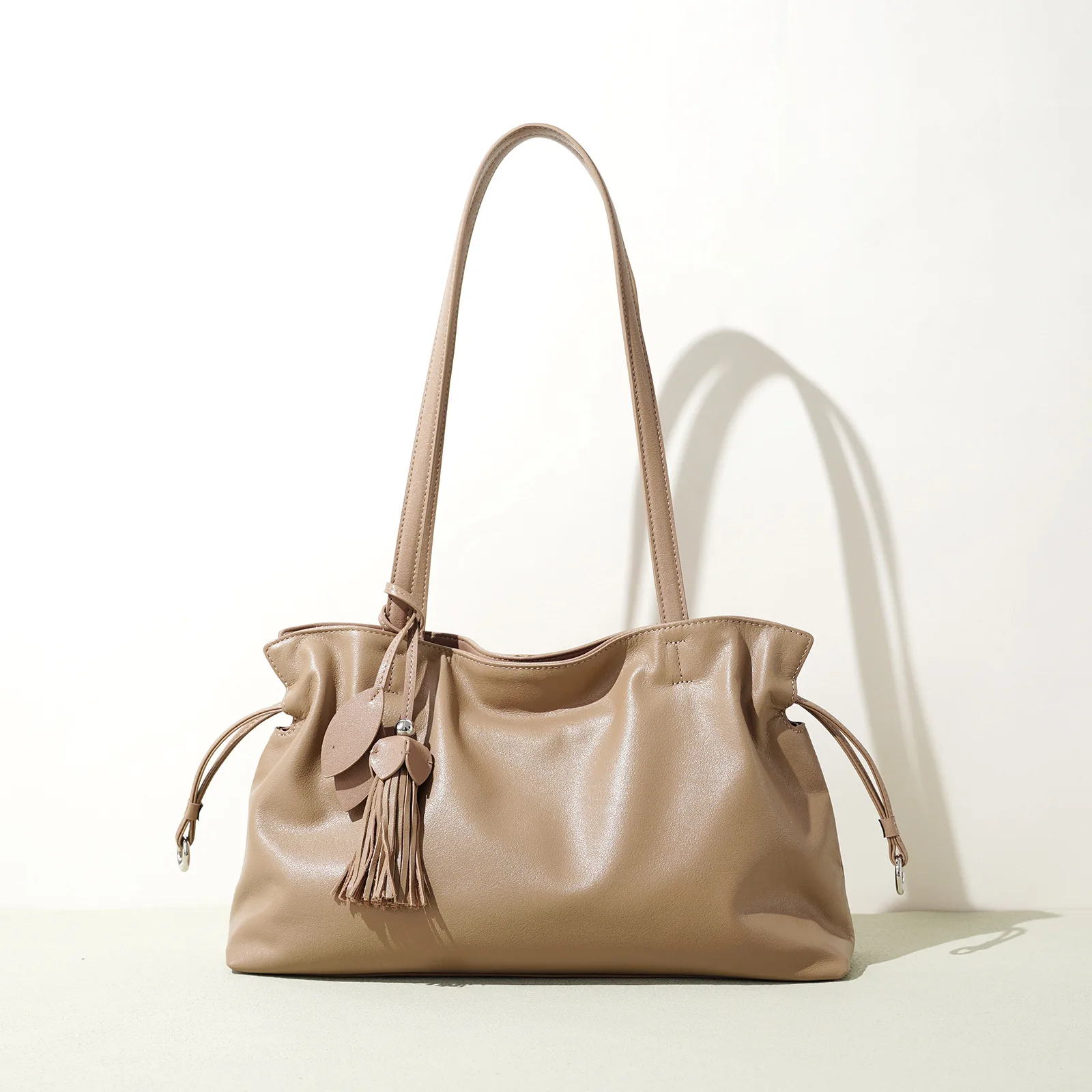 kf-S5cfe24d38a3f48a88bc0365a823e9133s Women's Premium Top-Grain Cowhide Drawstring Tote Bag with Tassel Charm Large Capacity Daily Commuter Shoulder Crossbody Bag - Image 1